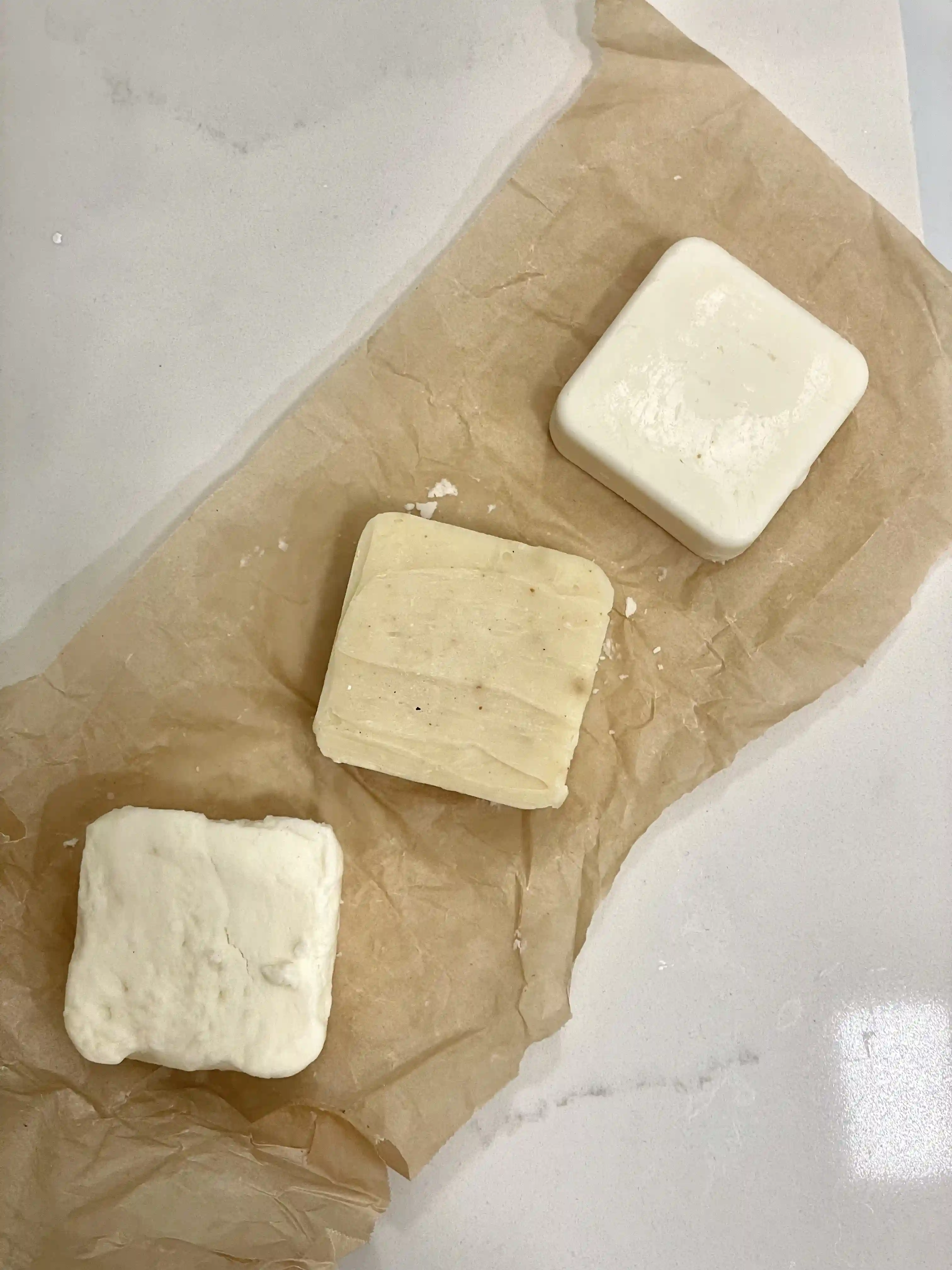 Progression of handmade shampoo and conditioner bar prototypes